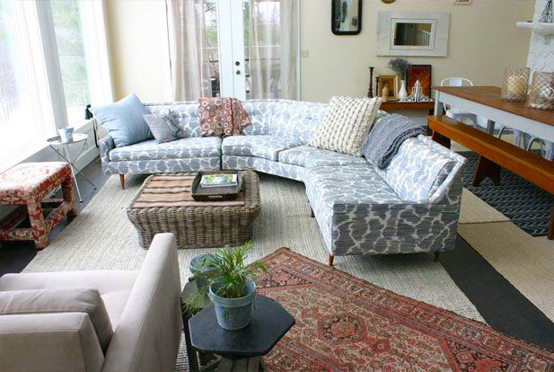 Living Room Interior With Layered Oriental Rugs by Nazmiyal