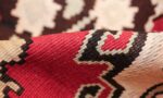 vintage red background turkish kilim rug 50381 pile Nazmiyal