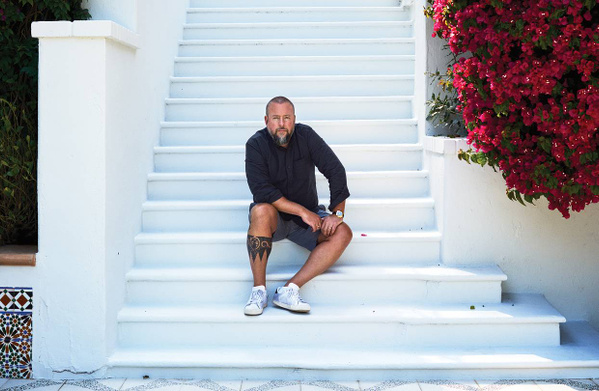 Shane Smith sitting on the steps of his new Santa Monica villa. Shane Smith sitting on steps of new Santa Monica Villa