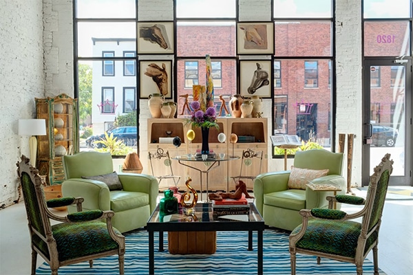 A Mid Century Vintage Rug in Room shows beautiful bold colors and eclectic furniture.
