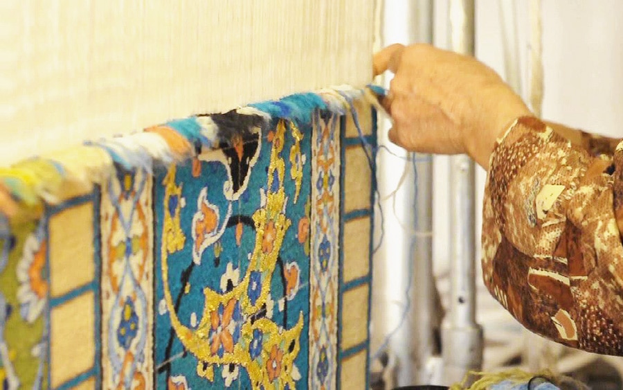 Persian City Rug Weaver Weaving a Fine Carpet Persian City Rug Weaver Weaving a Fine Carpet Nazmiyal