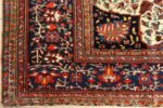 antique red background sarouk farahan persian rug 51095 corner Nazmiyal