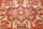antique red background serapi persian rug 48240 center Nazmiyal