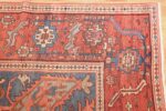 antique red background serapi persian rug 48240 corner Nazmiyal