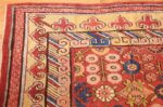 small antique red background khotan rug 49033 corner Nazmiyal