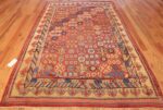 small antique red background khotan rug 49033 whole Nazmiyal