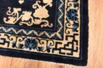 Image of Corner of Small Antique Peking Foo Dog Chinese Rug #70039 from the collection of Nazmiyal Antique Rugs NYC