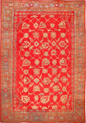 Picture of the Large Size All Over Design Rich Red Color Background Antique Turkish Oushak Rug #70012 from Nazmiyal Antique Rugs in NYC.