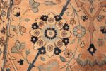 A detailed picture of center flower of the large vase design antique persian kerman rug #50701 from Nazmiyal Antique Rugs NYC
