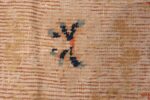 A detailed close up picture of the rare antique 17th century chinese ningxia carpet #70071 from Nazmiyal Antique Rugs NYC