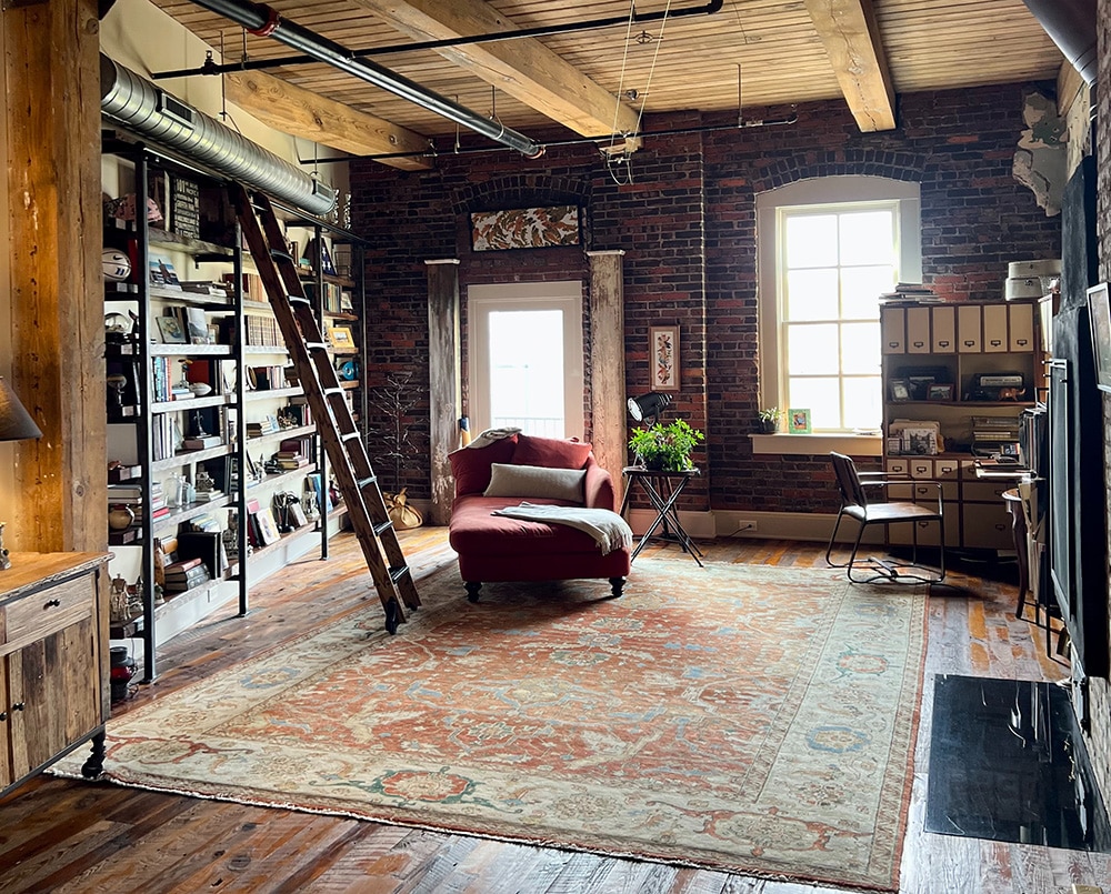 Rustic Exposed Brick NYC Loft Interior With Tribal Rug - Nazmiyal