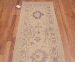 Top of Soft Ivory Cream Background Pastel Color Tribal Geometric Turkish Oushak Design Modern Hallway Runner Rug 11194 by Nazmiyal Antique Rugs