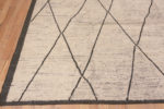 Corner of Minimalist Tribal Ivory Cream Background Charcoal Color Moroccan Beni Ourain Design Modern Room Size Rug 11501 by Nazmiyal Antique Rugs
