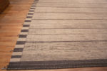 Corner of Oversized Neutral Cream Color Minimalist Geometric Stripes Design Modern Area Rug 11864 by Nazmiyal Antique Rugs