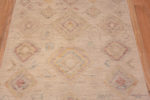 Details of Light Cream Ivory Color Background and Soft Rustic Tribal Pattern Modern Hallway Runner Rug 11049 by Nazmiyal Antique rugs