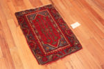 Side View of Small Scatter Size Red Blue Tribal Geometric Antique Turkish Yastic Rug 72555 by Nazmiyal Antique Rugs