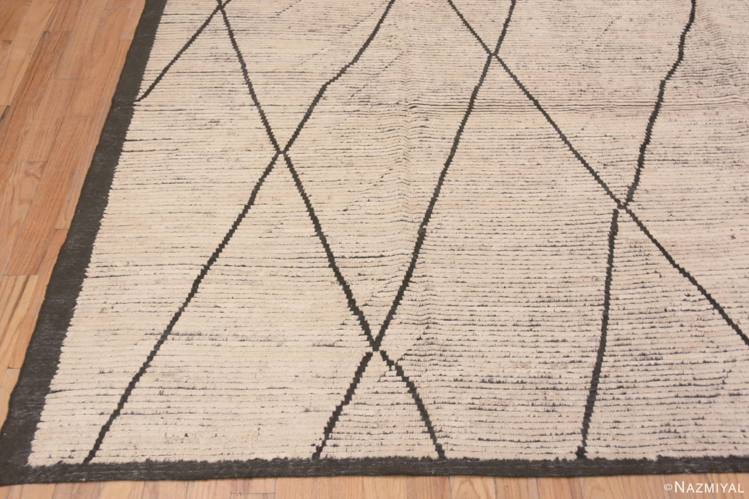 Corner of Minimalist Tribal Ivory Cream Background Charcoal Color Moroccan Beni Ourain Design Modern Room Size Rug 11501 by Nazmiyal Antique Rugs