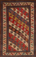 Vibrant Antique Caucasian Kazak Rug with Diagonal Paisley Motifs and Tribal Design Vibrant Antique Caucasian Kazak Rug with Diagonal Paisley Motifs and Tribal Design 73171 by Nazmiyal Antique Rugs