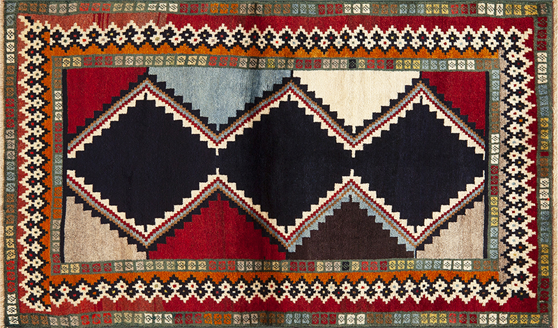 Striking Vintage Persian Gabbeh Rug with Bold Tribal Design and Vibrant Color Contrasts blog 73798 by Nazmiyal Antique Rugs