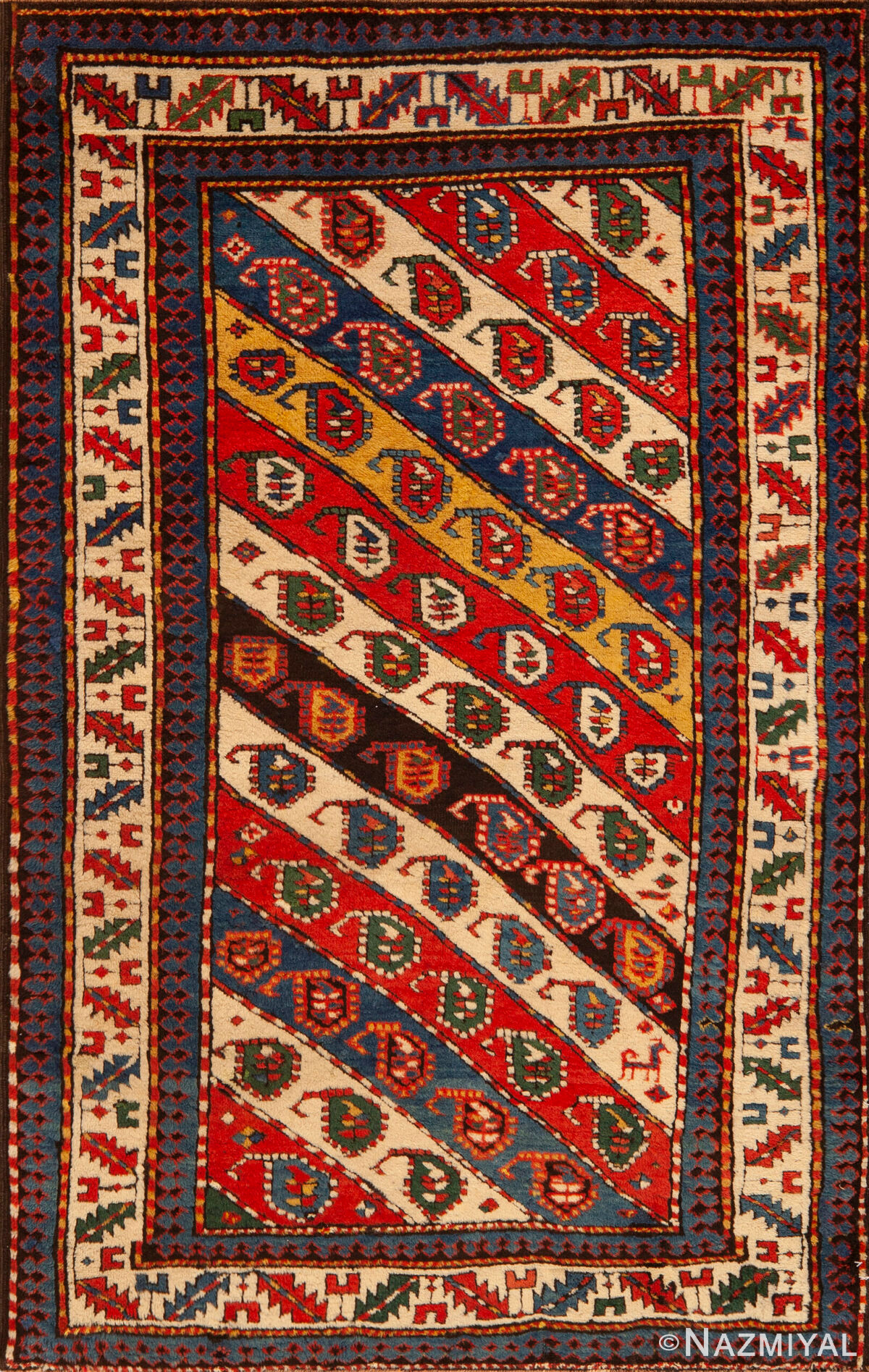 Vibrant Antique Caucasian Kazak Rug with Diagonal Paisley Motifs and Tribal Design 73171 by Nazmiyal Antique Rugs