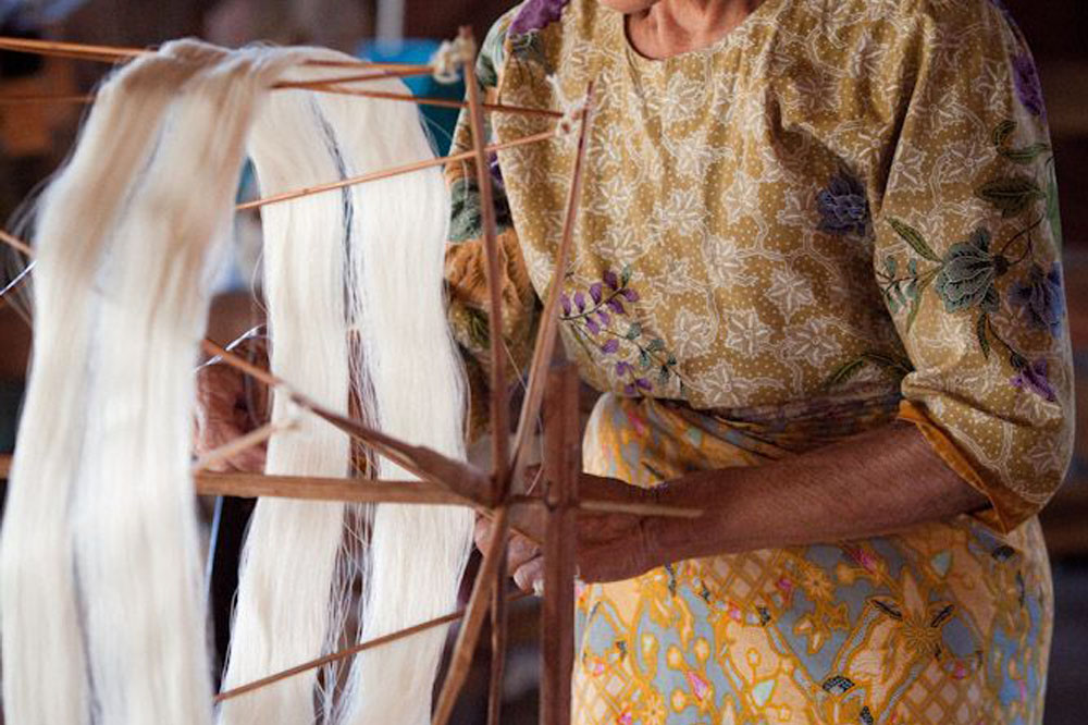 Woman Working on Silk Loom