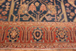 Border of Majestic Lion Garden: Antique Persian Bakshaish Rug in Indigo and Flame Border of Majestic Lion Garden: Antique Persian Bakshaish Rug in Indigo and Flame 73575 by Nazmiyal Collection