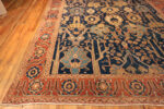 Corner of Majestic Lion Garden: Antique Persian Bakshaish Rug in Indigo and Flame Corner of Majestic Lion Garden: Antique Persian Bakshaish Rug in Indigo and Flame 73575 by Nazmiyal Collection