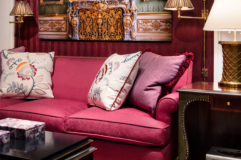 Alexa Hampton Interior with Wine Color Couch