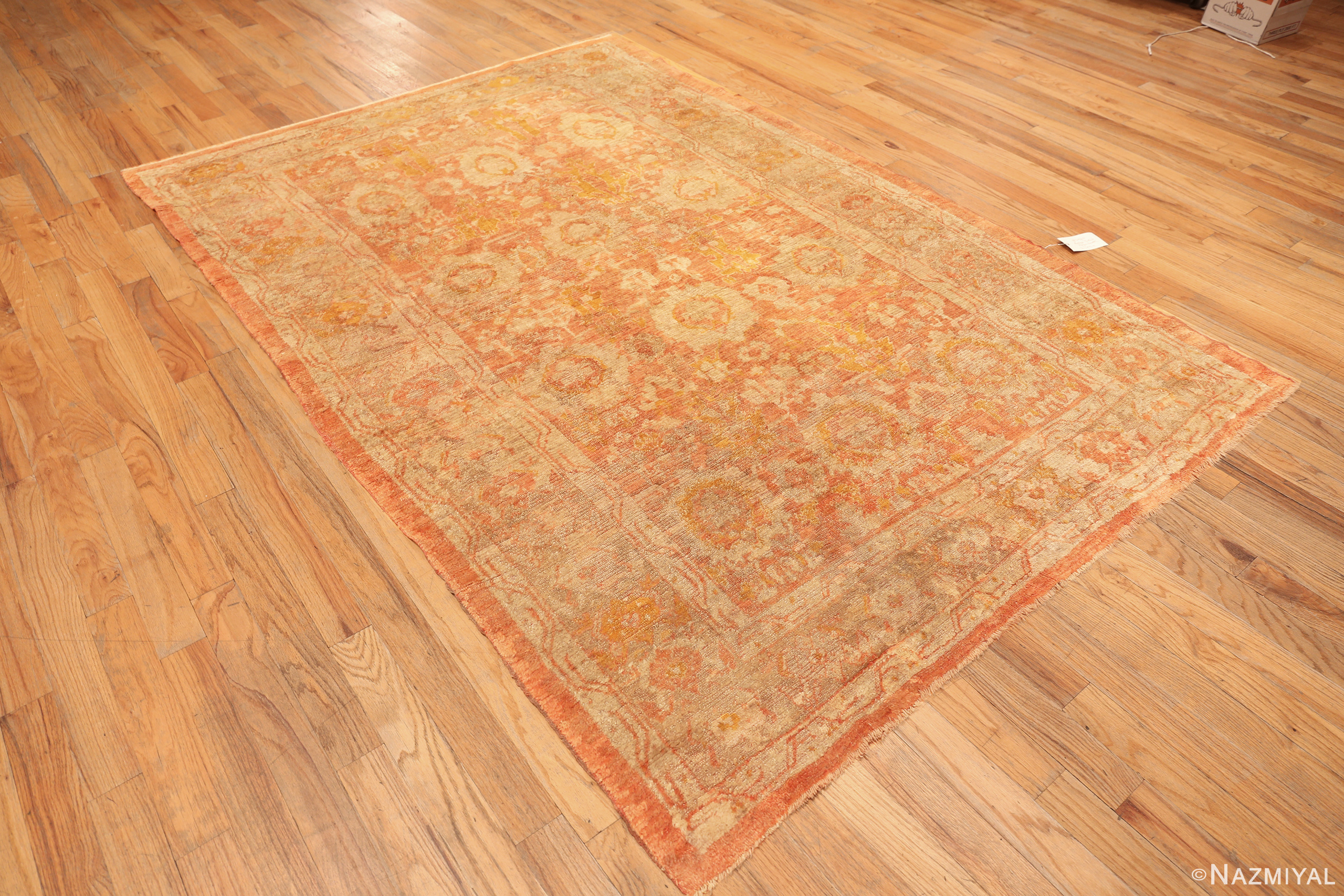Floor View of Antique Turkish Angora Oushak rug 74165 with an allover floral pattern in salmon, ivory, and soft golden tones.