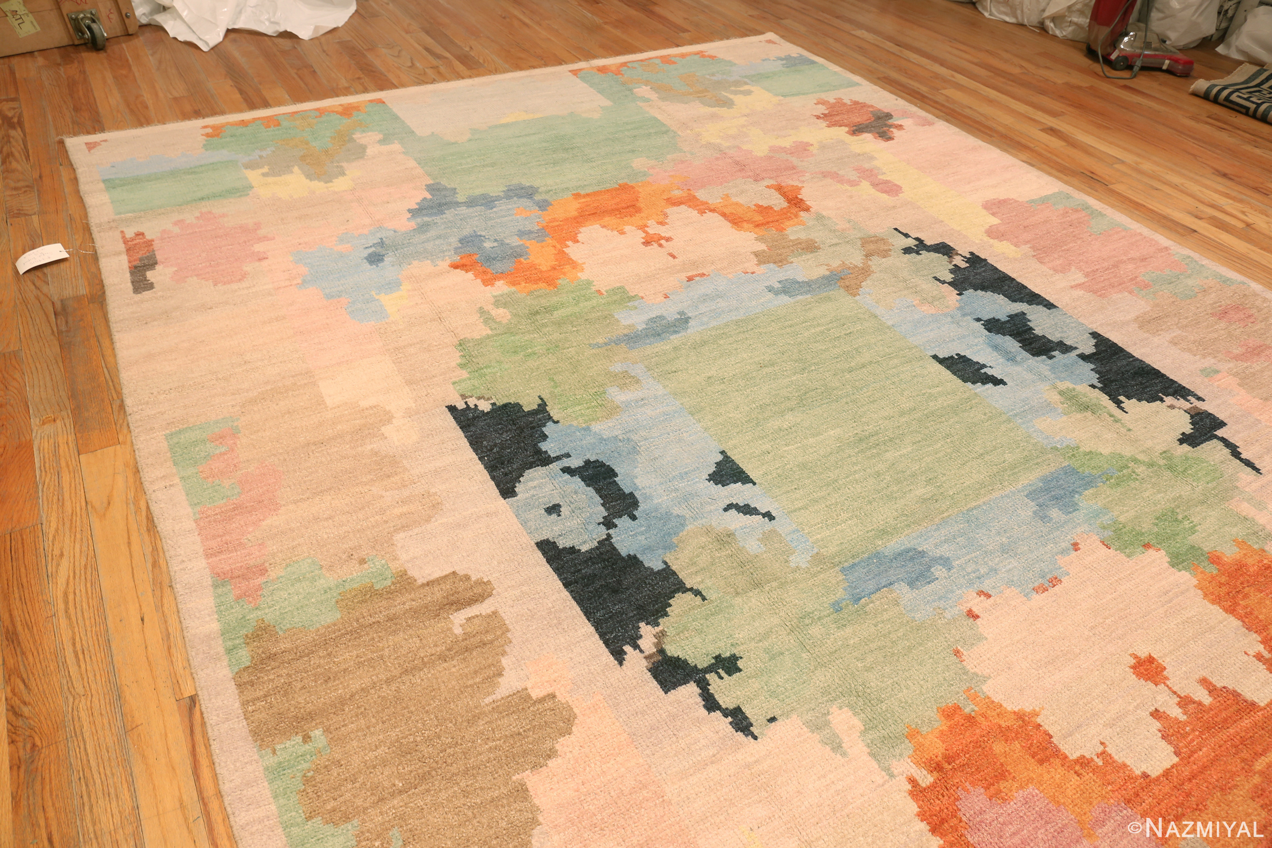 Floor view of Large modern Swedish-inspired abstract rug 74515 with sage green, pink, blue, orange, and ivory geometric forms.