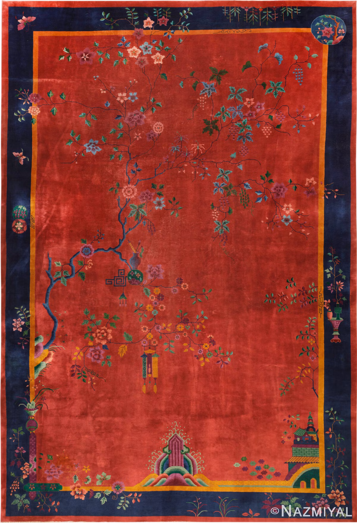 Large antique Chinese Art Deco rug 74449 with flowering branches, hanging ornaments, a red field, and a deep blue border.